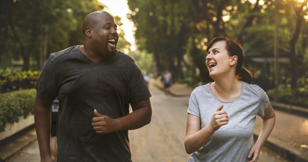 couple running laughing scaled e