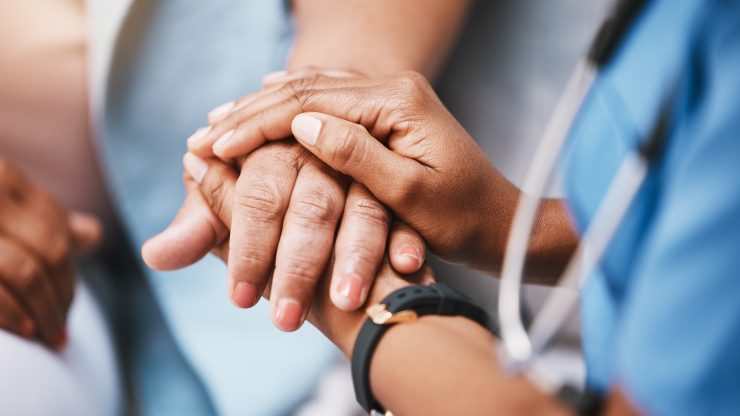 Empathy trust and nurse holding hands with patient for help consulting support and healthcare advice Kindness counseling and medical therapy in nursing home for hope consultation and psychology